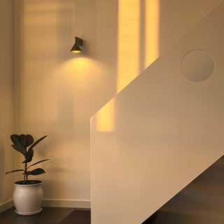 Bauhaus wall lamp illuminating modern staircase with warm ambient light - minimalist interior lighting by Mirodemi