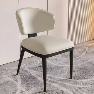close up of beige upholstered dining chair in modern interior