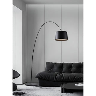 MIRODEMI modern black arc floor lamp beside dark sectional sofa in elegant contemporary living room