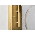 Luxury villa exterior with modern gold outdoor wall sconce lighting the entrance at night
