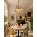Calyra multicolor Murano glass chandelier installed in a stylish modern café interior with pastel decor