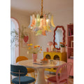 Luxury Murano glass chandelier above a colorful modern dining room with artistic interior decor