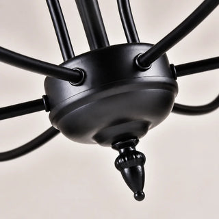 Detail of the curved arms, base and finial of the Candelara candle chandelier