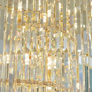 Close-up of Cap d'Ail chandelier illuminated crystal tiers and gold frame