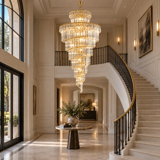 Cap d'Ail custom crystal chandelier in a double-height entryway with a sweeping staircase