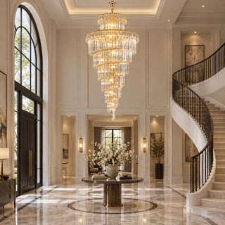 Cap d'Ail custom crystal chandelier in a grand foyer beside a curved staircase