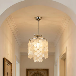 Close-up of a capiz shell pendant chandelier with a metal canopy on a light arched ceiling