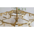 Close-up of the top of a capiz shell chandelier showing gold metal rings and translucent circular shells hanging in layers