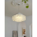 Close-up of decorative capiz shell chandelier with chrome frame in stylish contemporary interior