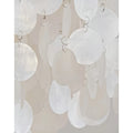 Detailed view of translucent capiz shells hanging in layers from silver rings on a chandelier