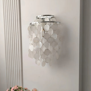 Side view of a chrome Capiz Shell Wall Sconce highlighting the layered shell disc arrangement and contemporary design