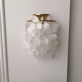 Front view of a gold Capiz Shell Wall Sconce with cascading natural shell discs for modern and coastal interiors