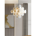 Cassia cream glass cluster chandelier in chrome finish styled in a modern living room