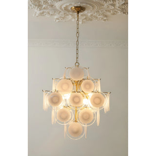 Front view of the illuminated Cassia cream glass cluster chandelier in copper