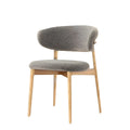 Angled view of Casto chair in khaki fabric with natural solid wood frame for modern dining spaces