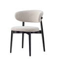 Elegant Casto chair featuring white upholstery with a clean black wooden structure