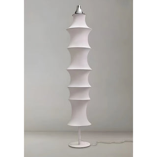 Celeste white silk modern floor lamp showing its ribbed structure unlit on a grey background