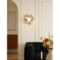 Elegant Celestia Marble & Glass Wall Sconce in flower white marble lighting a contemporary living space.
