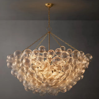Large 98 cm round chandelier with textured glass globes and gold frame, illuminated close view