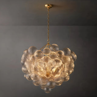 Round gold chandelier with ribbed clear glass globes clustered in a sculptural sphere design.