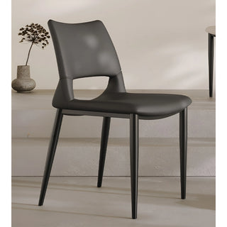 Black minimalist chair in front view with sculpted seat and modern curved backrest