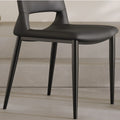 Close-up of black chair legs and seat construction, showcasing fine craftsmanship and finish