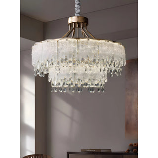 Clear 2-tier crystal chandelier in elegant interior with textured glass panels and hanging crystal prisms