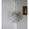 Side view of a clear Murano glass chandelier with textured sculptural elements