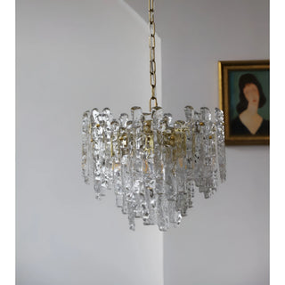 Side view of a clear Murano glass chandelier with textured sculptural elements