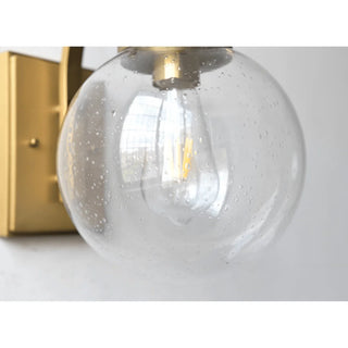 Detail of transparent textured glass globe with LED bulb inside, modern waterproof outdoor wall lamp
