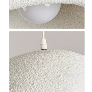 detailed close-up of white resin pendant lamp showing its rough plaster-like texture and bulb mount, minimalist lighting design details