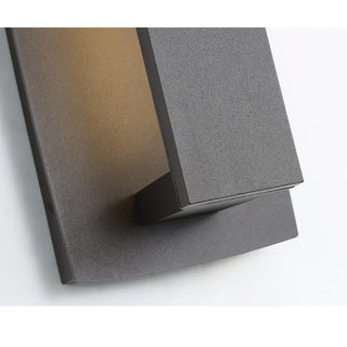 Close-up view of matte black wall light with modern textured finish