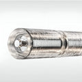 Detailed view of the chrome end cap of the transparent glass tube light fixture.