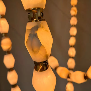 Close-up of warm cloudstonetexture – handcrafted Collier Chandelier by Mirodemi