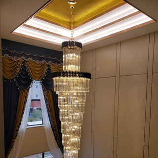 Tall art deco crystal chandelier in black and gold for a lobby and hall