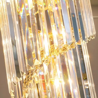 Detail of shimmering crystals on a black and gold chandelier