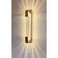 Close-up of the luxury crystal LED wall light with golden warm illumination