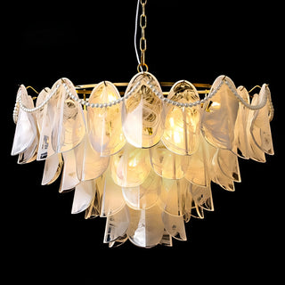 Designer glass chandelier with warm lighting and elegant layered silhouette