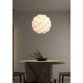 Elara white silk globe pendant light hanging in a modern living room