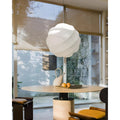Elara white silk pendant light styled over a contemporary dining table