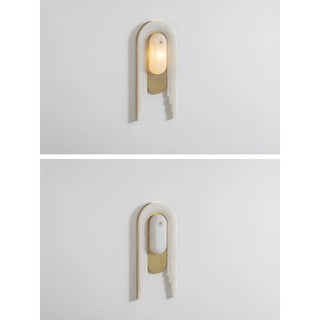 Two views of the marble and brass wall lamp, one illuminated and one turned off, on a white background