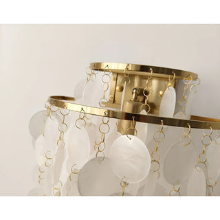 Close-up of the gold-finished frame with handcrafted capiz shell discs suspended in elegant cascading layers