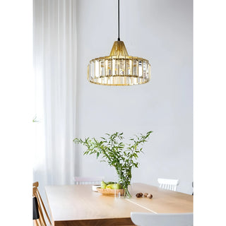 Gold K9 crystal pendant lamp illuminating a dining table in a bright modern interior