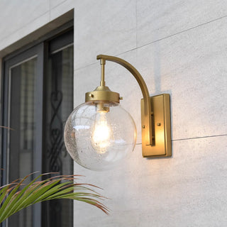 Gold outdoor wall light with clear glass globe and stainless steel base, ideal for patio, villa or balcony lighting