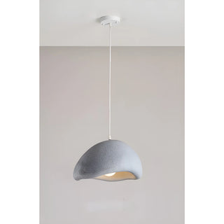 single gray sculptural pendant lamp with a curved organic design and warm light, hanging from white ceiling in neutral modern room
