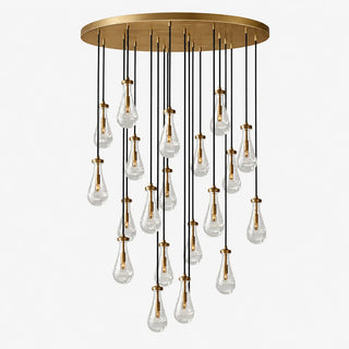 Guttara round 21-light raindrop chandelier with a brass canopy, studio view