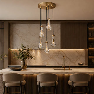Guttara round 5-light raindrop cluster over a marble kitchen island