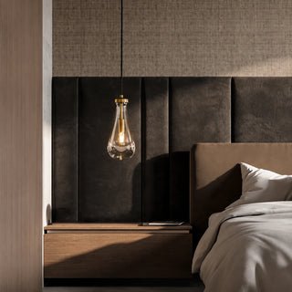 Guttara single raindrop pendant as a bedside light in a modern bedroom