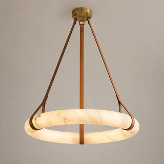 Halara alabaster ring chandelier with a brass canopy and tan leather straps, lit front studio view