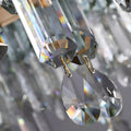 Close-up of precision-cut K9 crystal prisms reflecting rainbow light refractions